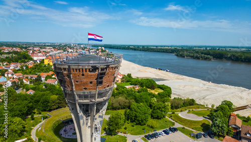 Vukovar Water Tower, a powerful symbol of Croatian resilience and courage, captured from the air. This iconic structure stands tall as a reminder of the city's heroic past