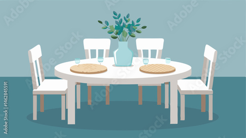 A simple white dining table with woven placemats and a vase of fresh eucalyptus stems.
