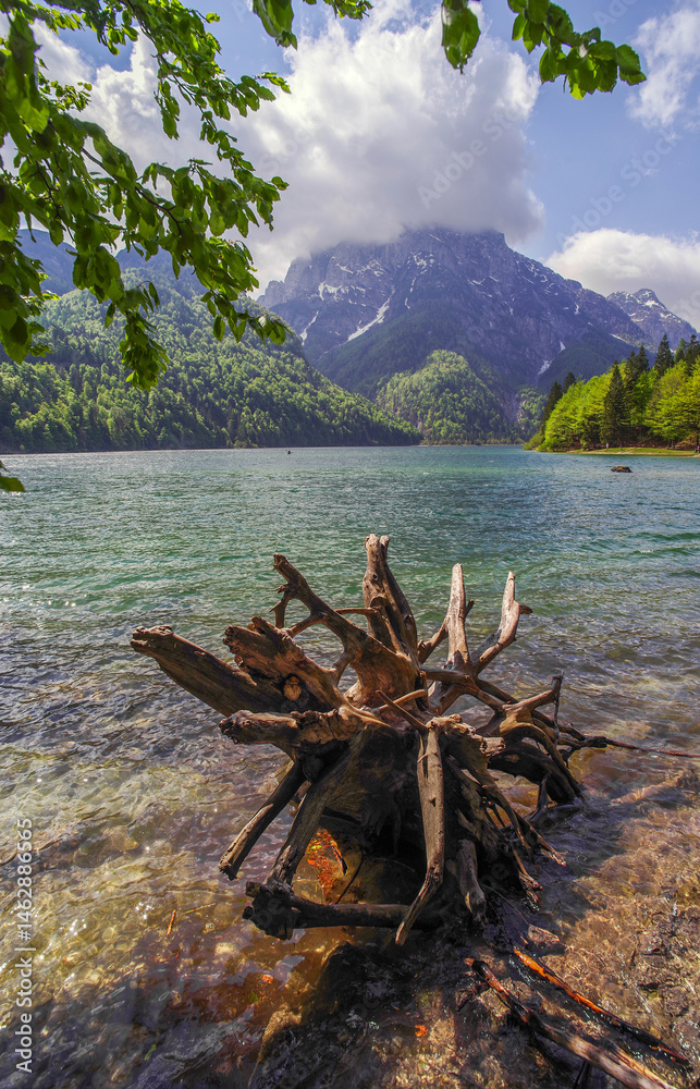 Predil Lake in the Julian Alps, Tarvisio with mountains in background, Italy, Europe