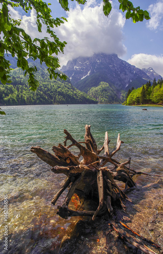 Obraz na płótnie Predil Lake in the Julian Alps, Tarvisio with mountains in background, Italy, Europe w salonie