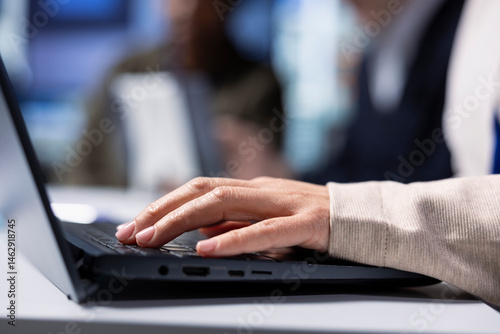 Obraz na płótnie Factory shareholder typing on laptop, monitoring system performance. Industrial manufacturing plant executive using notebook to track energy production and efficiency, closeup w salonie