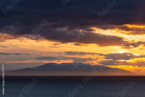 Canvas Print A vibrant sunset casts its colors over Cook Inlet in Anchorage, Alaska