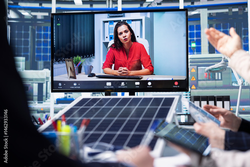 Obraz na płótnie Photovoltaics factory team in remote videoconference meeting improving development efficiency. Solar panels plant employees in office studying how to harness sun power during internet video call w salonie