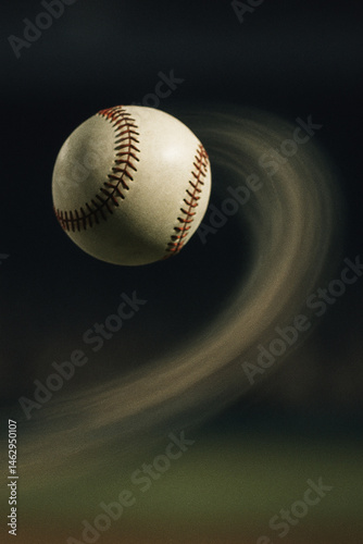 Baseball curveball in motion with dynamic blur trail