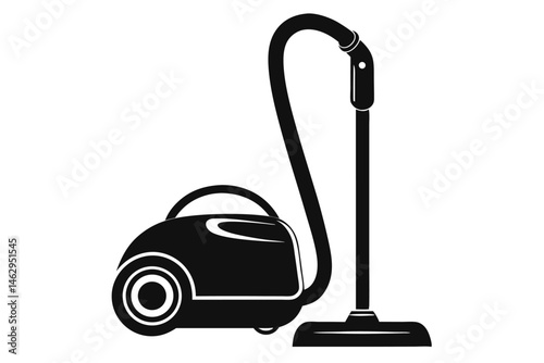 Black and white vacuum cleaner stands ready for use in household cleaning tasks