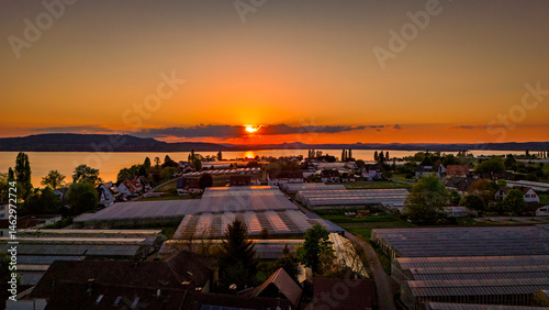 Obraz na płótnie Aerial view over Reichenau Island in Lake Constance with large gardening greenhouses and sundown, Baden-Württemberg, Germany w salonie