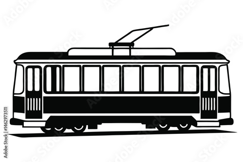 A black and white tram stands with its doors open along the road