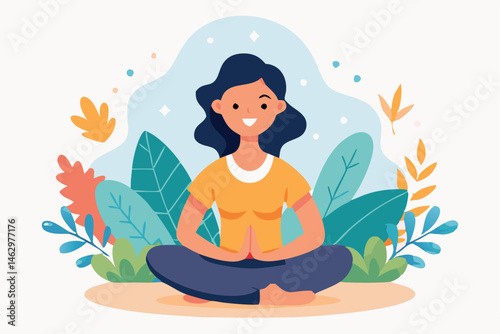 Smiling woman with dark hair and yellow shirt sits in lotus position amidst leaves