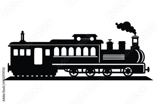 Locomotive train with passenger car is viewed in silhouette on flat surface and smoke rises
