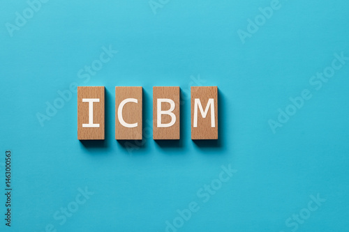 There is wood block with the word ICBM. It is an abbreviation for intercontinental ballistic missile as eye-catching image.