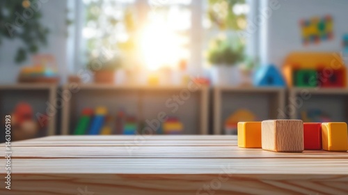 Obraz na płótnie Close-up of wooden building blocks on a light wooden table with a blurred colorful playroom background and sunlight coming through the window w salonie