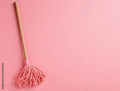 Pink cleaning tool on pink background (1)
