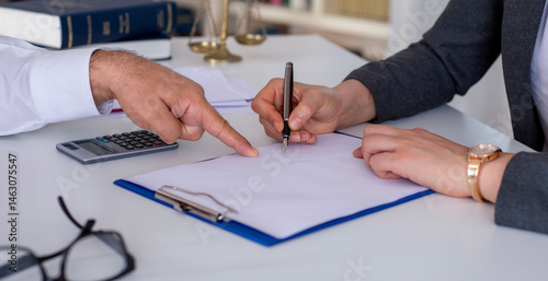 woman signing real estate contract
