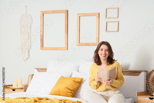 Young woman reading book ne...