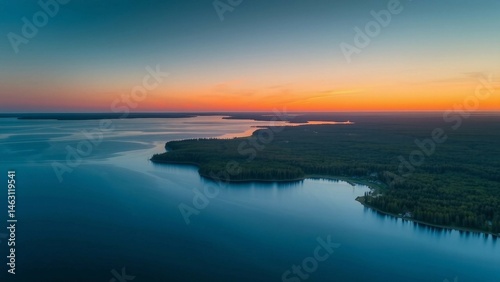 Clear blue Saimaa lake at sunset, Finland, aerial view. Picturesque panoramic scenery. Atmospheric