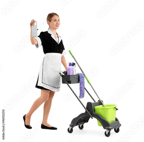 Smiling hotel maid pushing ...