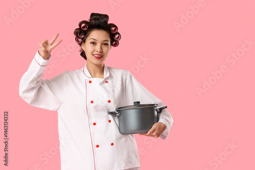 Female Asian chef with hair...