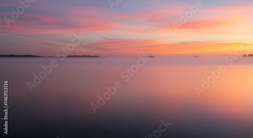 Ethereal Sunrise Landscape Over The Foggy Water In Shades Of Pink