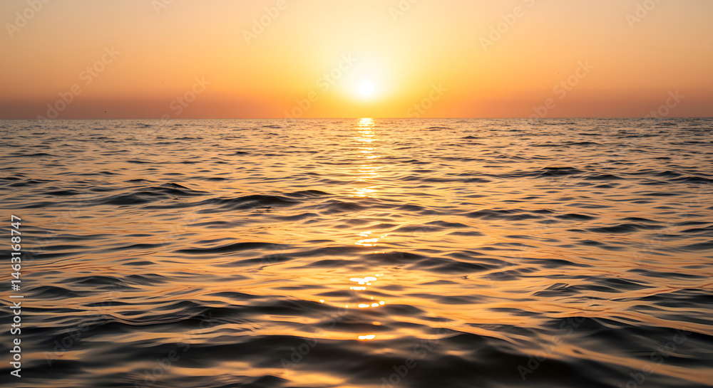 Fototapeta premium Golden Hour Over Sea Ripples Tranquil Water Surface At Sunset