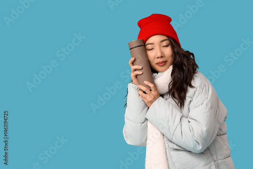 Young Asian woman in winter...
