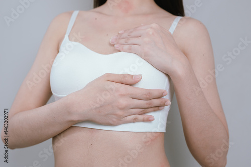 Wallpaper Mural Young slim woman in lingerie stands in a studio, showcasing a toned figure with smooth skin, emphasizing beauty, wellness, and fitness. Torontodigital.ca