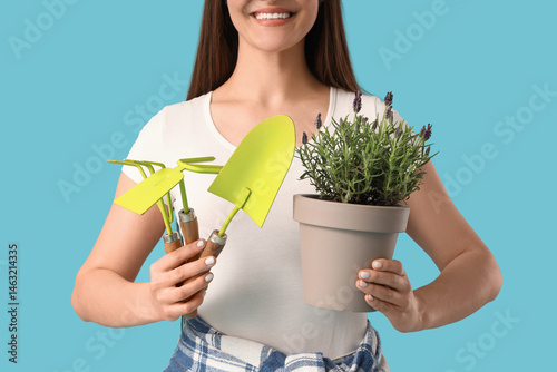 Young woman holding pot wit...
