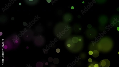 Floating bokeh light particles drift in darkness—ideal for dreamy, romantic, or elegant transitions and overlays. photo