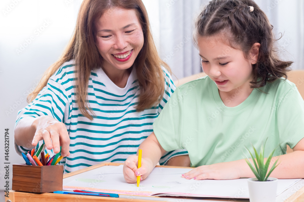 Asian mother and young daughter coloring, playing together bonding relationship family, mom multitasks and child share free time joyful drawing, teaching schoolwork with little girl, homeschool kid Asian mother and young daughter coloring, playing together bonding relationship family, mom multitasks and child share free time joyful drawing, teaching schoolwork with little girl, homeschool kid