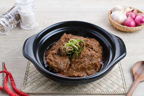 Rendang Daging Sapi, traditional food from Padang, Indonesia. Beef stew with spices, herbs and coconut milk
 photo