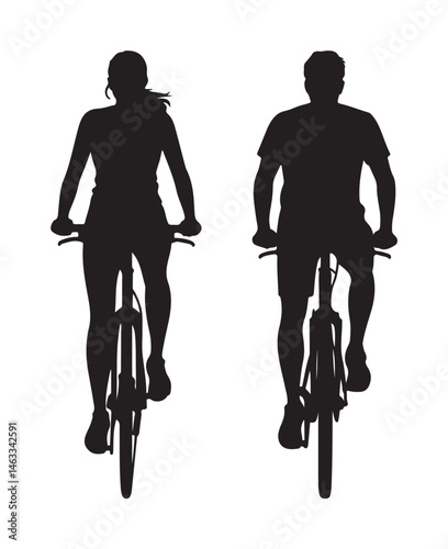 Silhouette of a couple riding a bicycle
