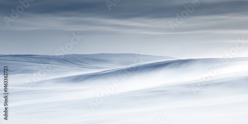 Serene Winter Landscape:  A Breathtaking View of Snow-Covered Hills Under a Cloudy Sky