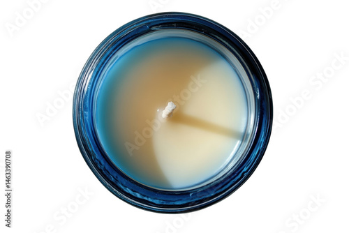 Unlit cream candle in a blue glass jar ready to bring warmth and serenity to your space Top on transparent background
