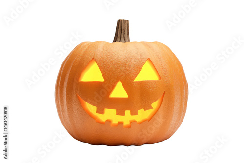 Illuminated jack o lantern with a smiling face against a dark 