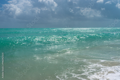 Sea waves background. Summer ocean water motion. Ocean splash wave background. Deep blue sea beach. Turquoise wave. Dreamy exotic sea beach. Beautiful sea beach waves.