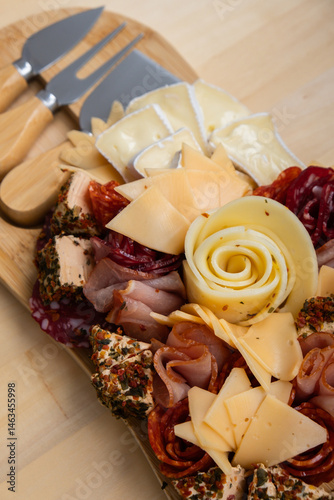 Food trend gift aperitivo party idea. Appetizers wooden grazing board with different antipasti charcuterie snacks and cheese. Assorted cheese meat platter. Disordered eating. Girl dinner