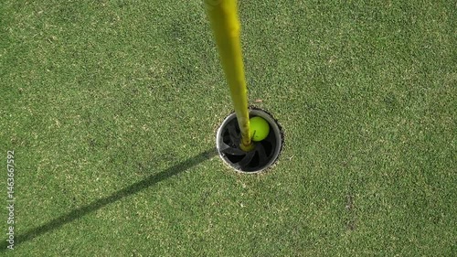 bird eye Shot of Golf Ball Dropping into the Hole