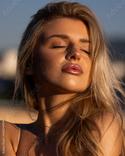 Close-up portrait of a beautiful woman with sun-kissed makeup in golden tones, glowing skin, and soft summer vibes. Warm sunlight highlights her natural beauty, perfect for beauty, fashion, and lifest
