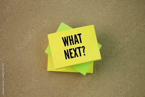 Colored paper with the word question What's Next? next step concept