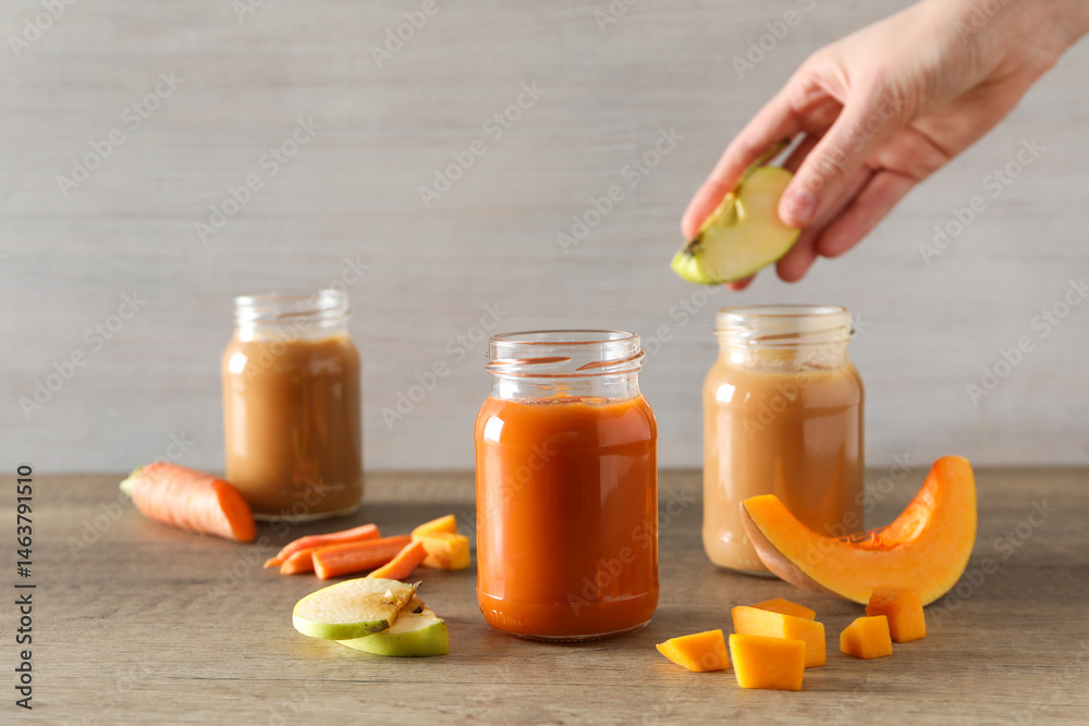 Children's vegetable and fruit puree, on a light background.