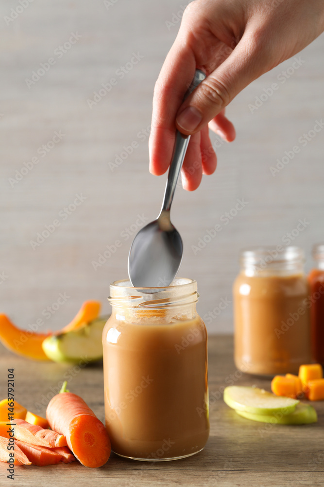 Children's vegetable and fruit puree, on a light background.