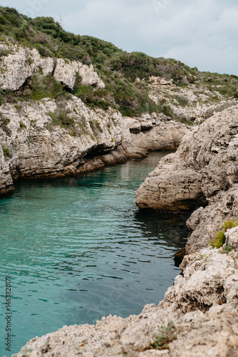 Rocky inlet and turquoise water at Cala en Brut, Menorca