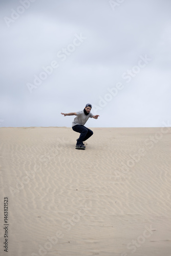 Sandboarder cruising down dune. Cañoncillo, Perú.