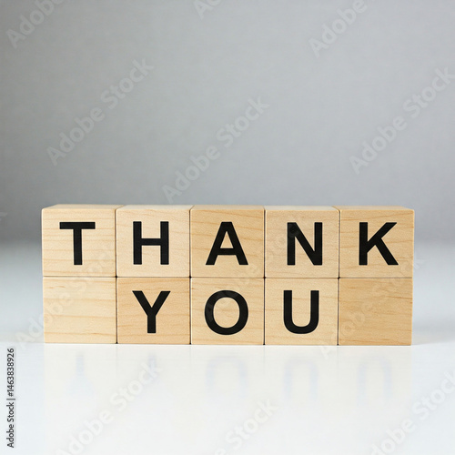 Obraz na płótnie The word THANK YOU written in wooden cubes on a white background w salonie