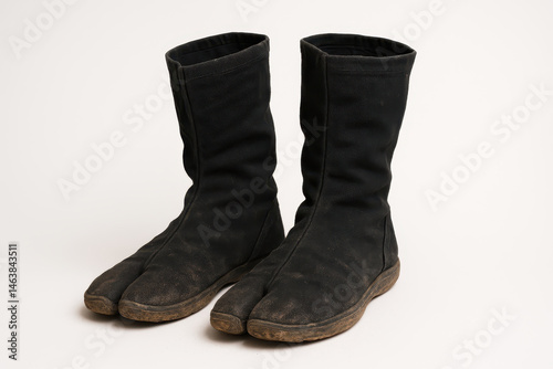 Wallpaper Mural Unique Two-Toed Boots Designed for Traditional Activities Displayed on Neutral Background Torontodigital.ca
