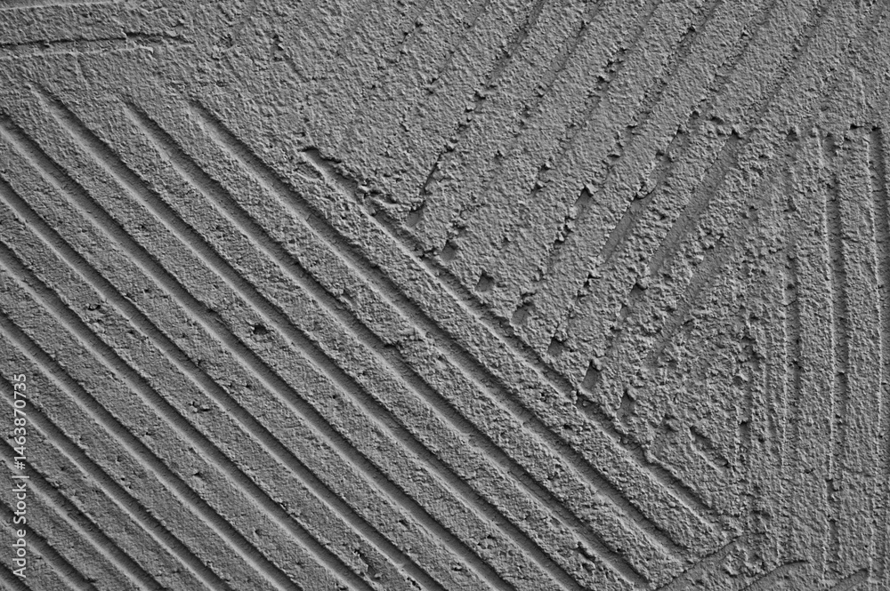 Fototapeta premium gray background, photo shows texture of decorative plaster on concrete wall close-up