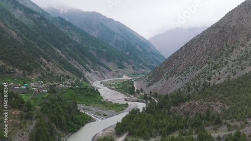 4K Aerial shot of Chenab river flowing through Lahaul valley, Himachal Pradesh, India. Mountain river in Himalayas. Environment and nature concept.
