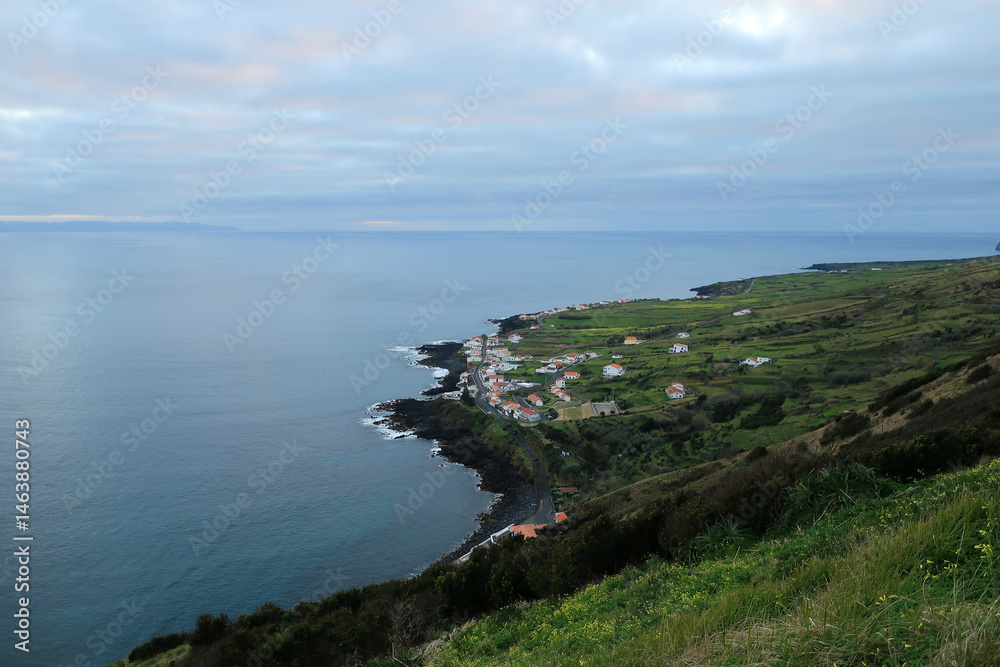 Fototapeta premium Viewpoint of the Carapacho houses on the edge of a slope below Caldeira da Graciosa, in Graciosa Island, Azores archipelago, Portugal