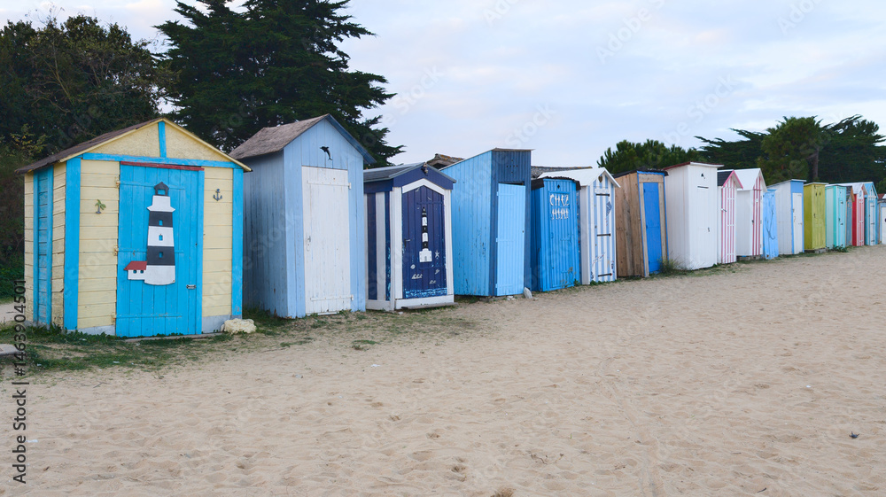 blue colorful wooden beach huts changing room on sand beach plage laboirie in Saint-Denis-d'Oleron france