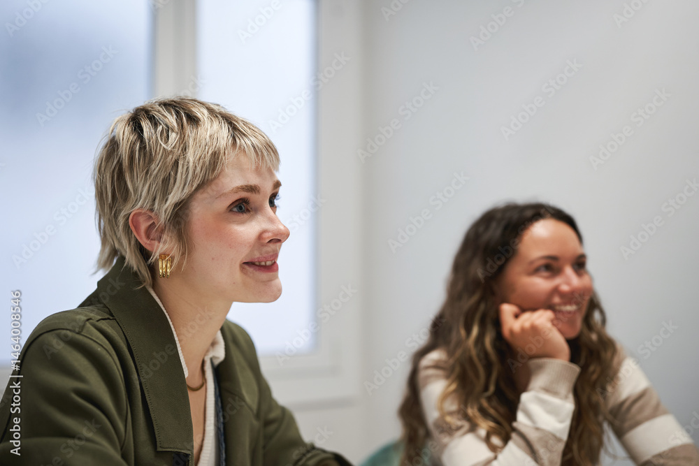 Fototapeta premium Creative team meeting with women in a modern office