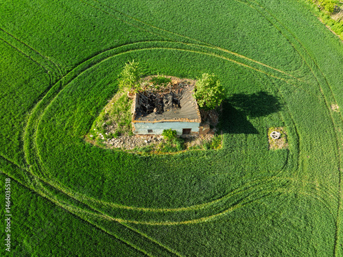 Aerial drone view of beautiful yellow fields rapeseed.Village country farming shapes in fields. Spring fields of yellow blooming rapeseed, growing plants. Fields in the Opole village from a drone.